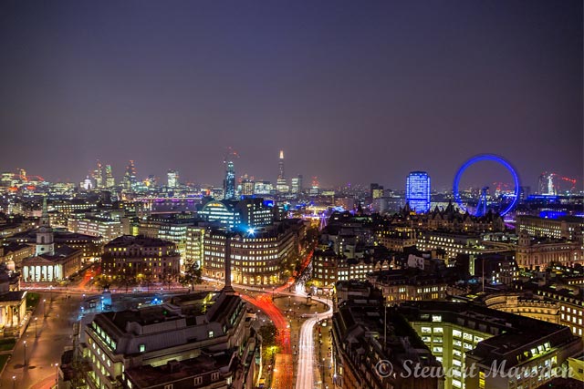 London at night with the London Eye on the right